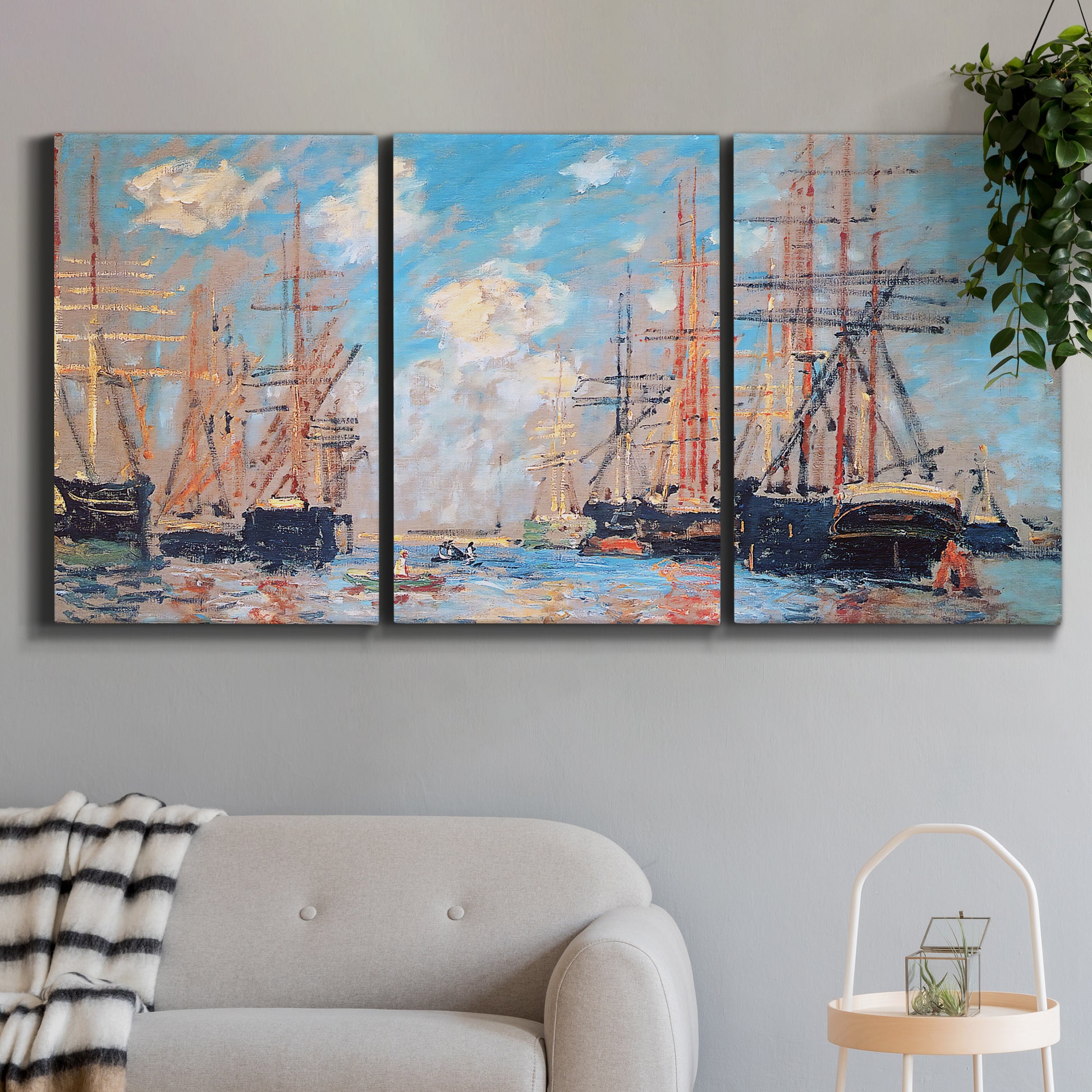 Three-panel canvas wall art featuring harbor with boats and water, displayed in a modern living room above a sofa.