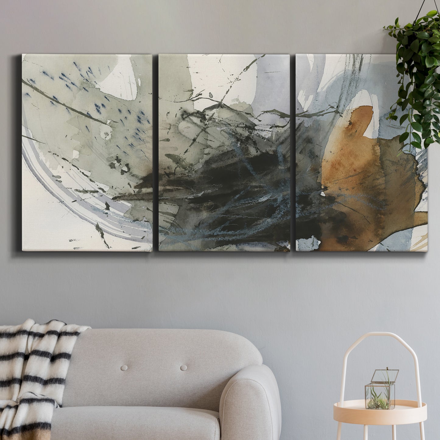 Three-panel canvas wall art featuring dynamic circular abstract motion, displayed in a modern living room above a sofa.