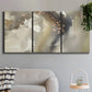 Three-panel canvas wall art featuring flowing abstract wave motion, displayed in a modern living room above a sofa.