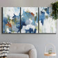 Three-panel canvas wall art featuring flowing abstract color movement, displayed in a modern living room above a sofa.