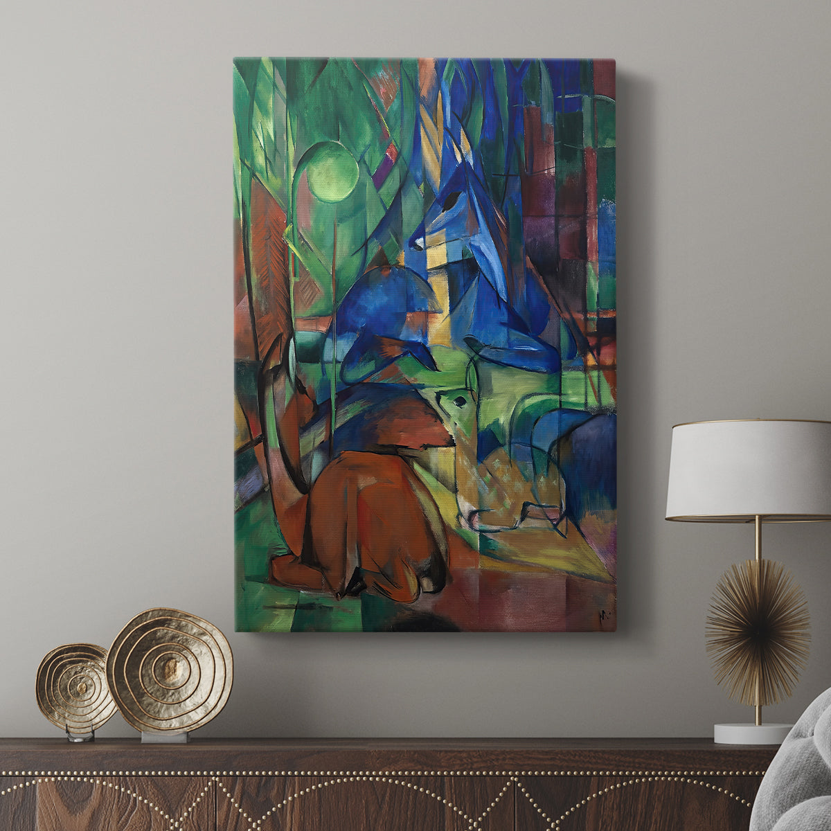 Canvas art print featuring a layered scene with abstracted deer and angular forms displayed in a modern interior space.