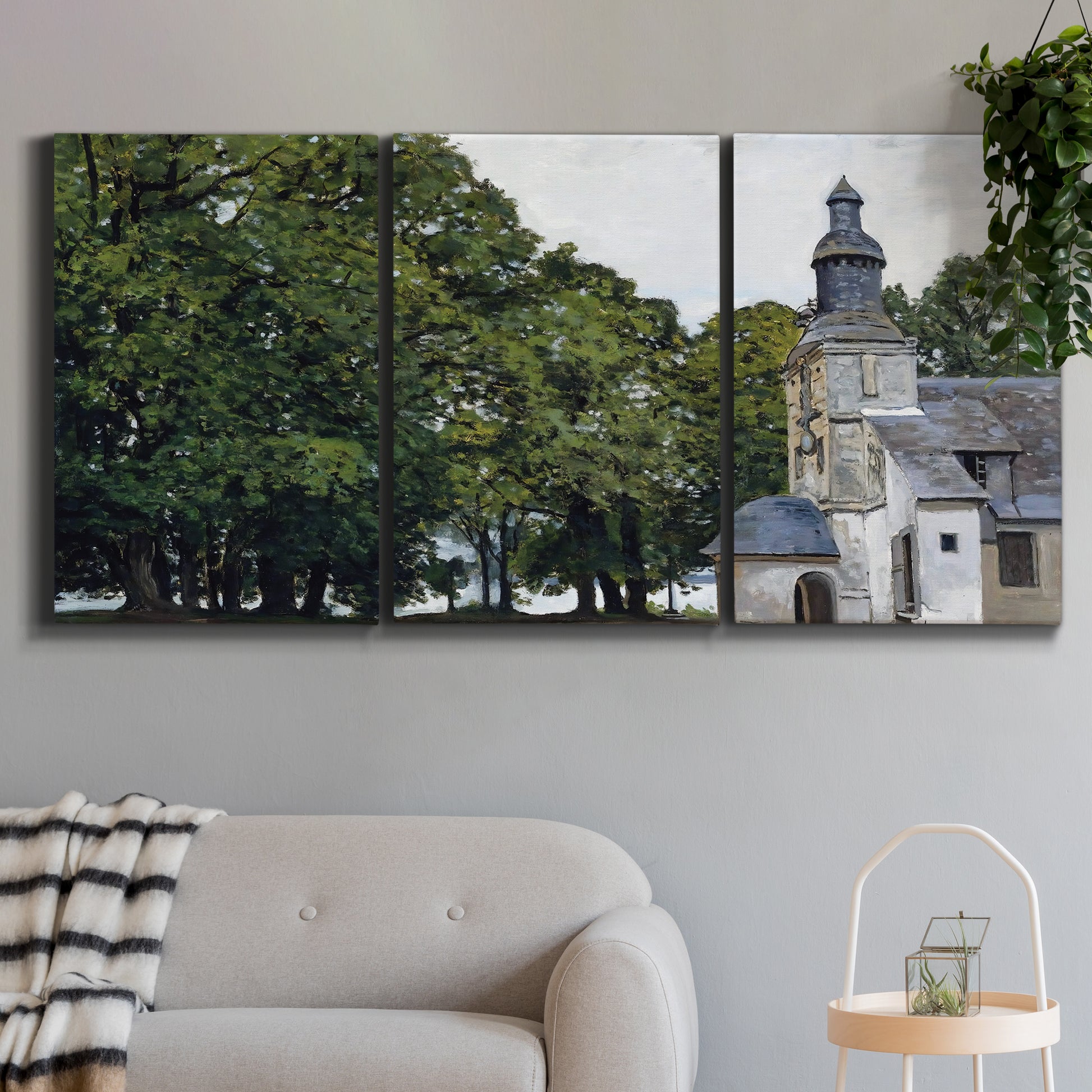 Three-panel canvas wall art featuring chapel building in rural setting, displayed in a modern living room above a sofa.