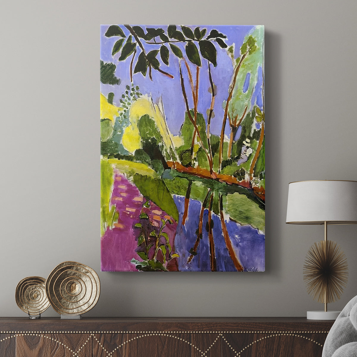 Canvas art print featuring a bright landscape with simplified forms and strong color displayed in a modern interior space.