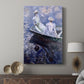 Canvas art print featuring a gentle water scene with figures in a small boat displayed in a modern interior space.