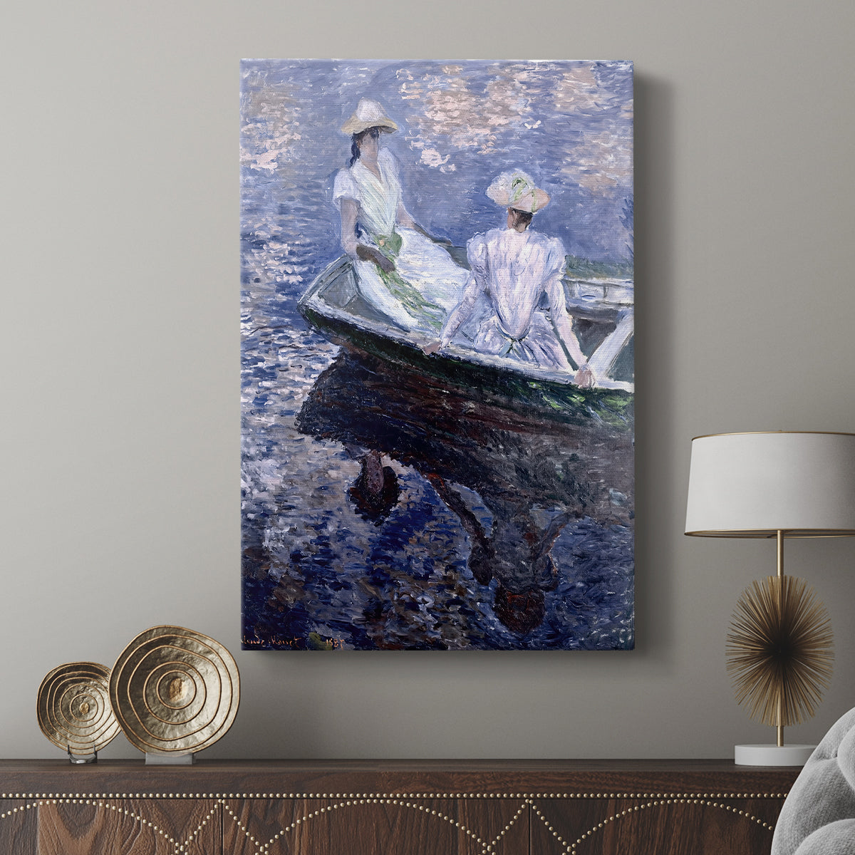 Canvas art print featuring a gentle water scene with figures in a small boat displayed in a modern interior space.
