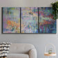 Three-panel canvas wall art featuring abstract evening landscape with depth, displayed in a modern living room above a sofa.