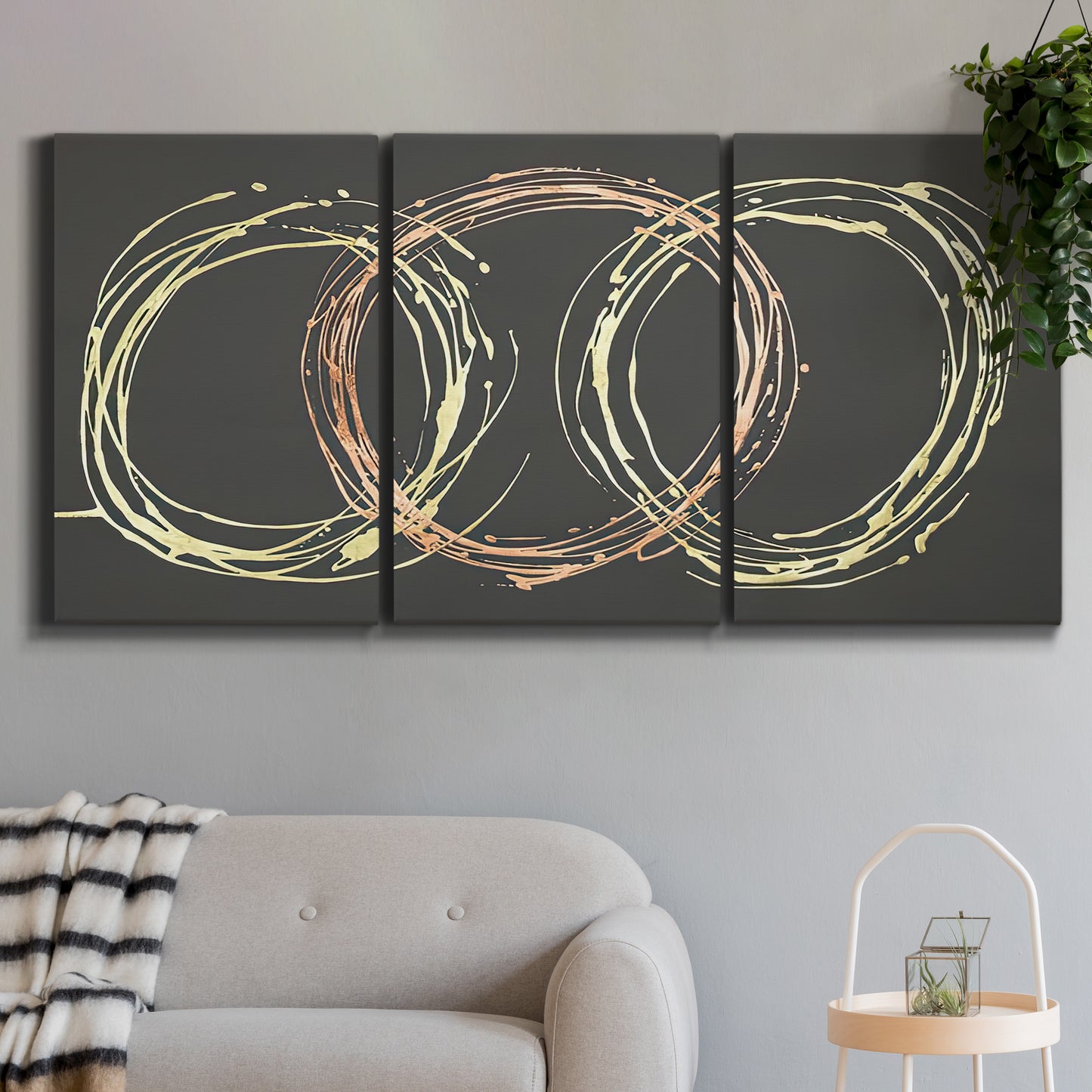 Three-panel canvas wall art featuring geometric abstract wave tangents, displayed in a modern living room above a sofa.
