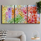 Three-panel canvas wall art featuring peaceful tropical inspired landscape, displayed in a modern living room above a sofa.