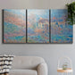 Three-panel canvas wall art featuring sunlit valley landscape, displayed in a modern living room above a sofa.