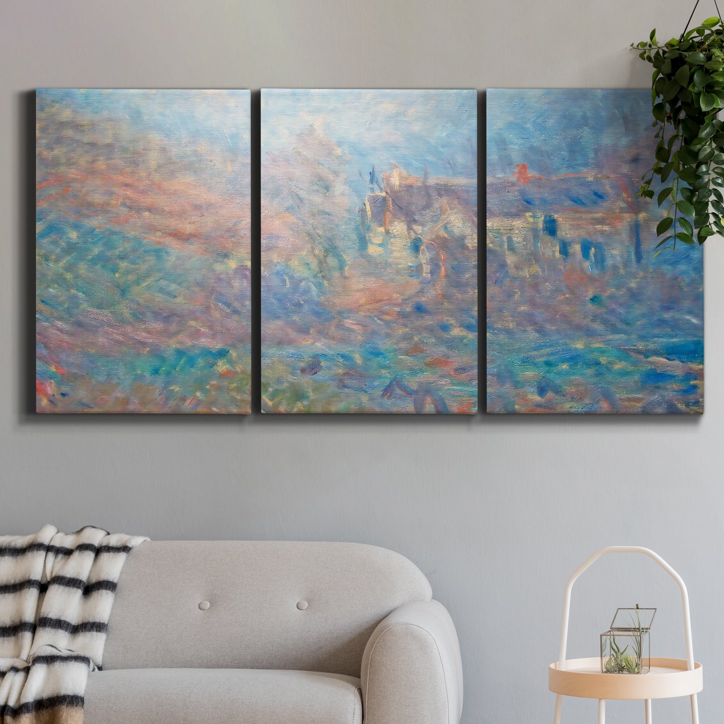 Three-panel canvas wall art featuring sunlit valley landscape, displayed in a modern living room above a sofa.