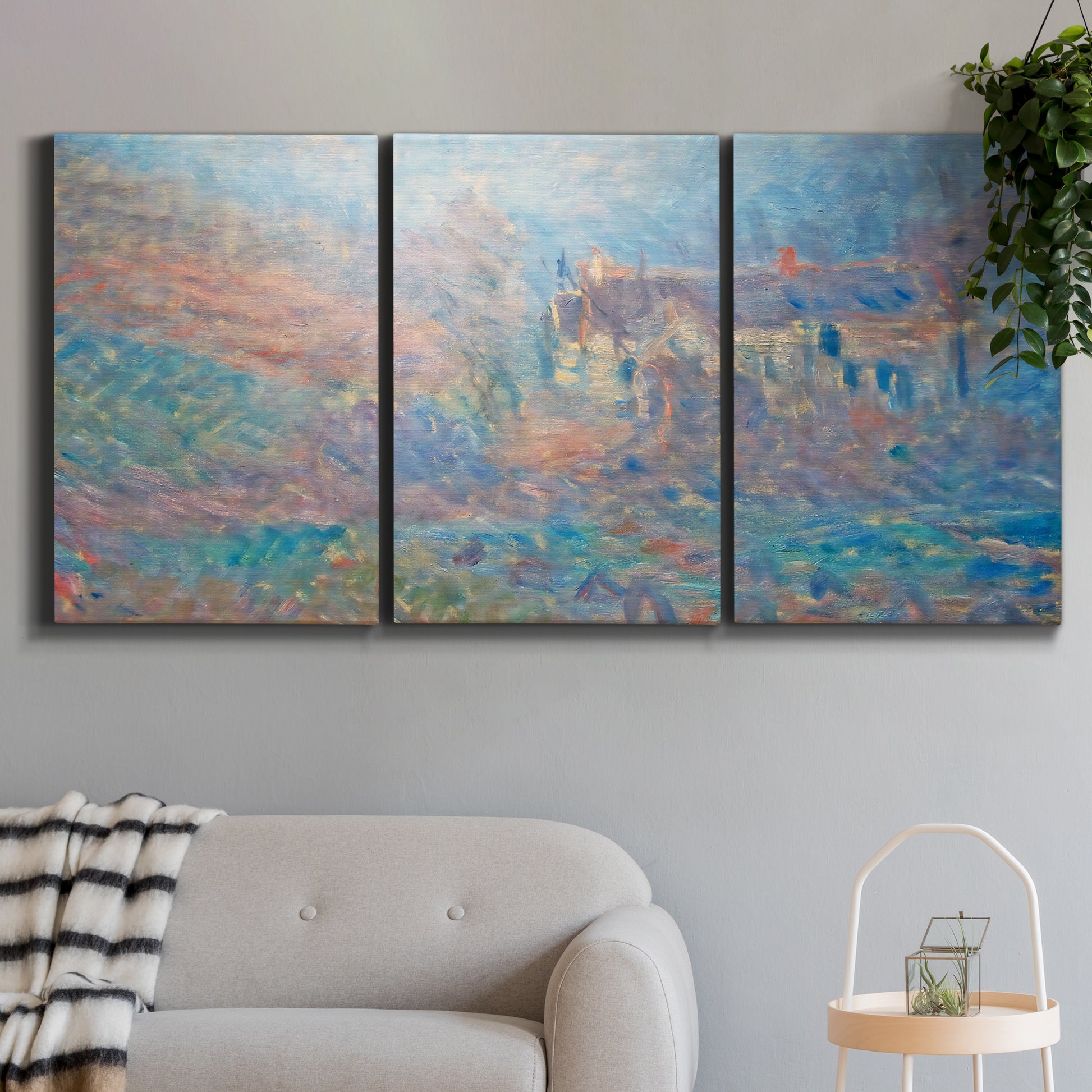Three-panel canvas wall art featuring sunlit valley landscape, displayed in a modern living room above a sofa.