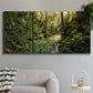 Three-panel canvas wall art featuring sun filtered woodland photograph, displayed in a modern living room above a sofa.