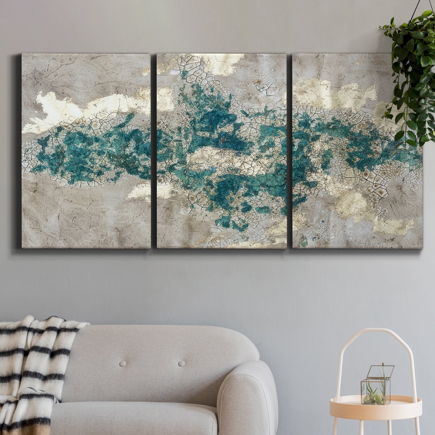 Three-panel canvas wall art featuring layered mineral abstract textures, displayed in a modern living room above a sofa.