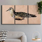 Three-panel canvas wall art featuring coastal bird illustration, displayed in a modern living room above a sofa.