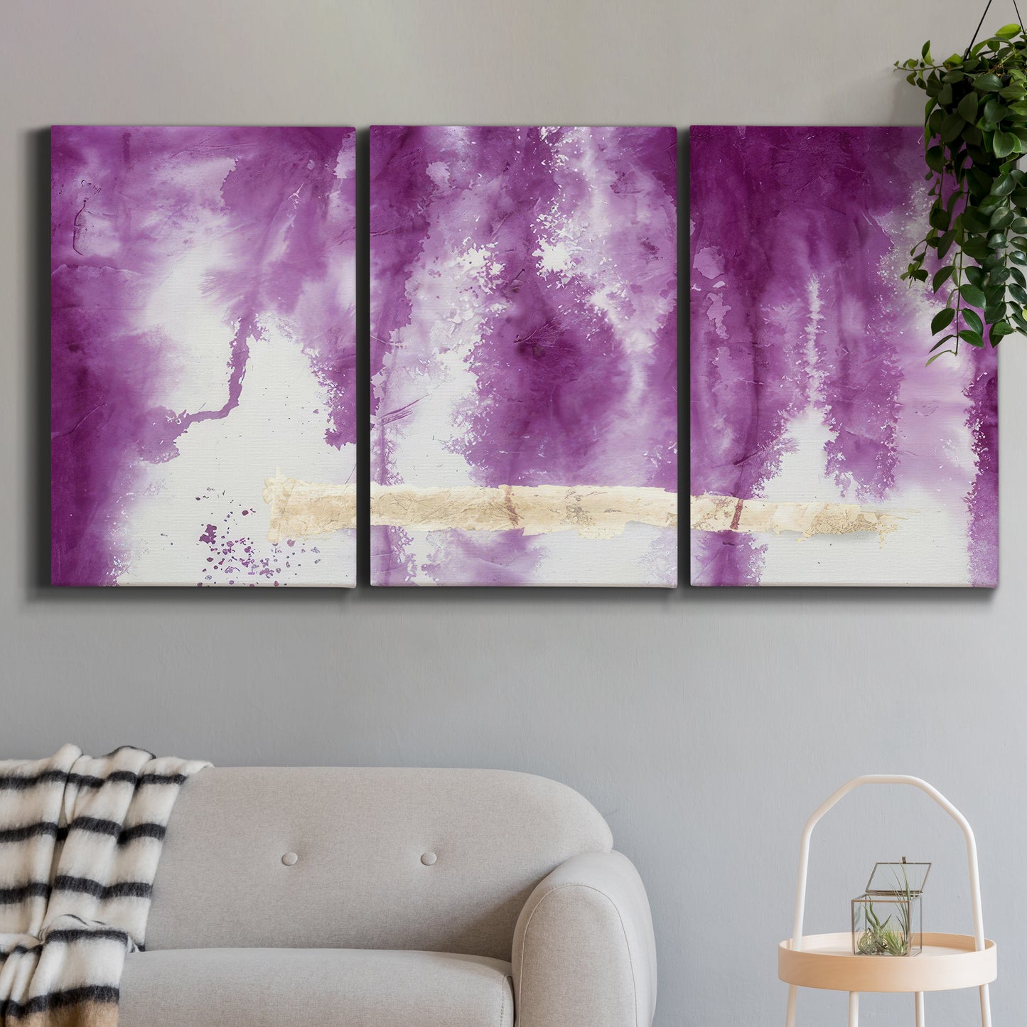 Three-panel canvas wall art featuring saturated abstract color fields, displayed in a modern living room above a sofa.