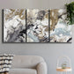Three-panel canvas wall art featuring marbled modern abstract textures, displayed in a modern living room above a sofa.