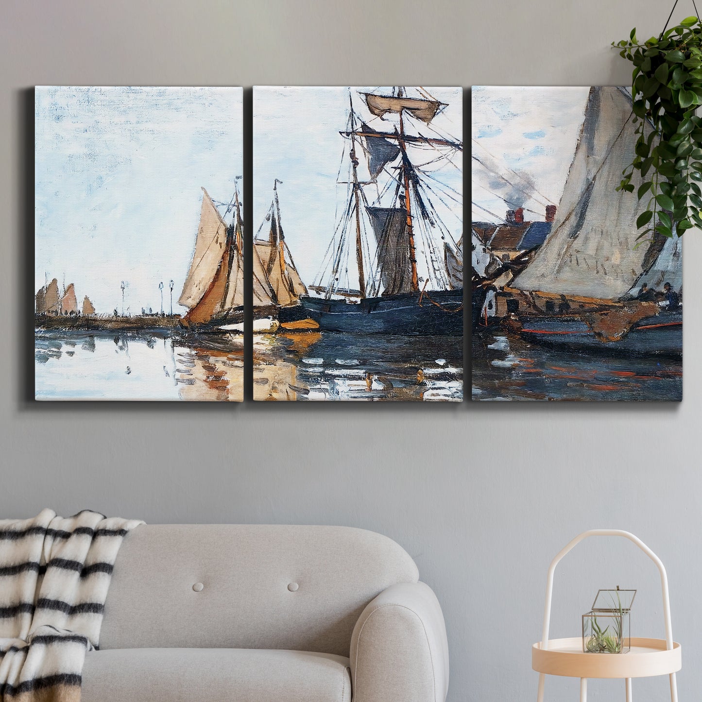 Three-panel canvas wall art featuring fishing boats navigating open water, displayed in a modern living room above a sofa.