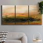 Three-panel canvas wall art featuring soft abstract evening light, displayed in a modern living room above a sofa.
