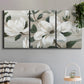 Three-panel canvas wall art featuring soft southern floral charm, displayed in a modern living room above a sofa.