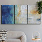 Three-panel canvas wall art featuring deep blue abstract grotto tones, displayed in a modern living room above a sofa.