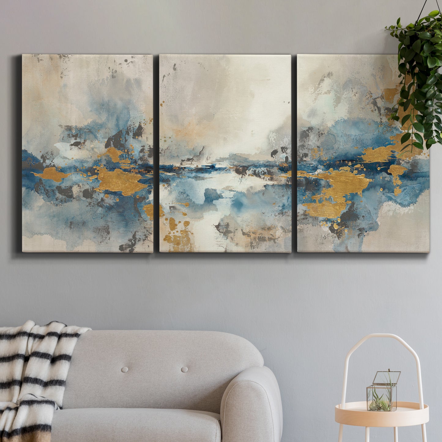 Three-panel canvas wall art featuring abstract soft morning light, displayed in a modern living room above a sofa.