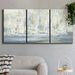 Three-panel canvas wall art featuring impressionist regatta scene with sailboats, displayed in a modern living room above a sofa.