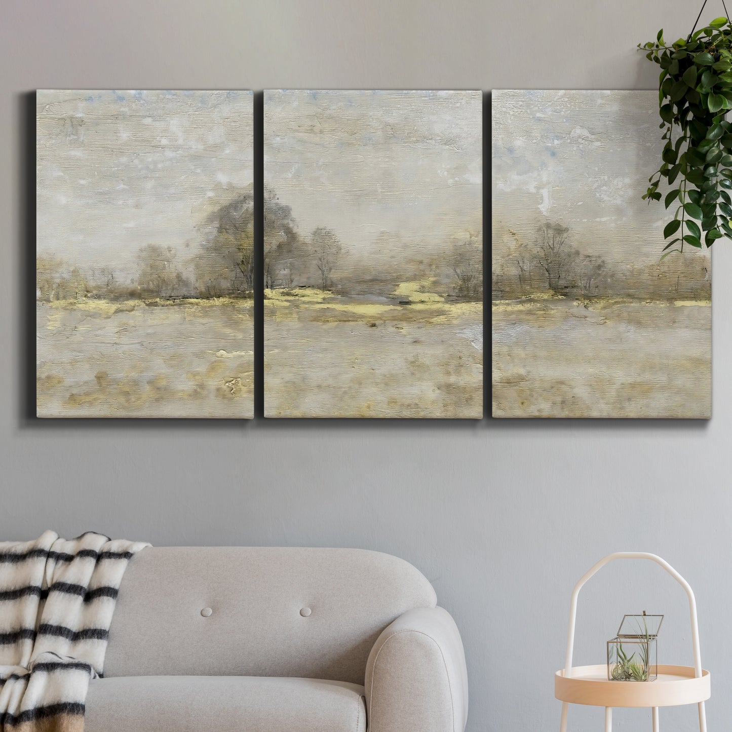 Three-panel canvas wall art featuring late season rural harvest fields, displayed in a modern living room above a sofa.