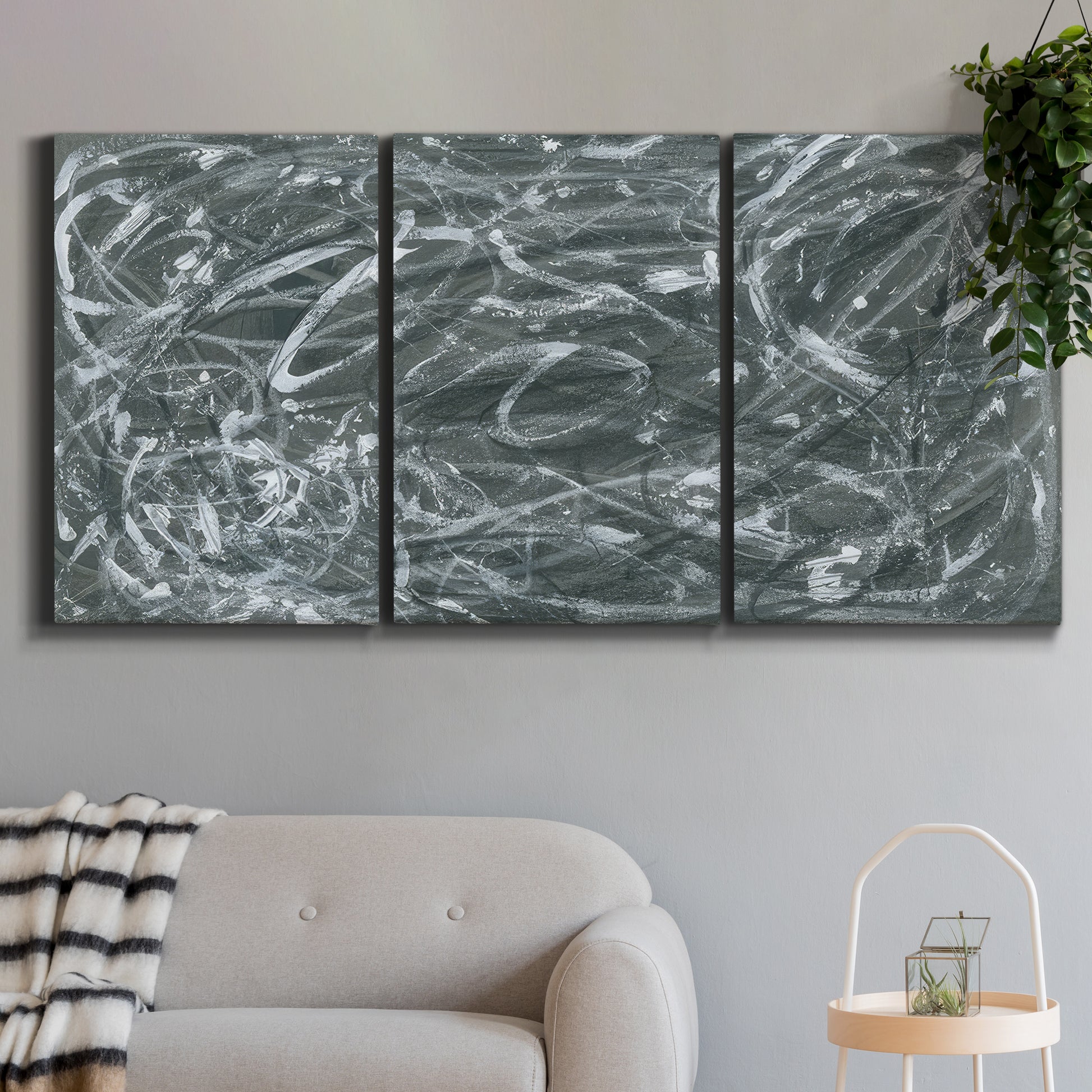 Three-panel canvas wall art featuring abstract view through window forms, displayed in a modern living room above a sofa.