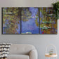 Three-panel canvas wall art featuring blue and purple water lily pond, displayed in a modern living room above a sofa.