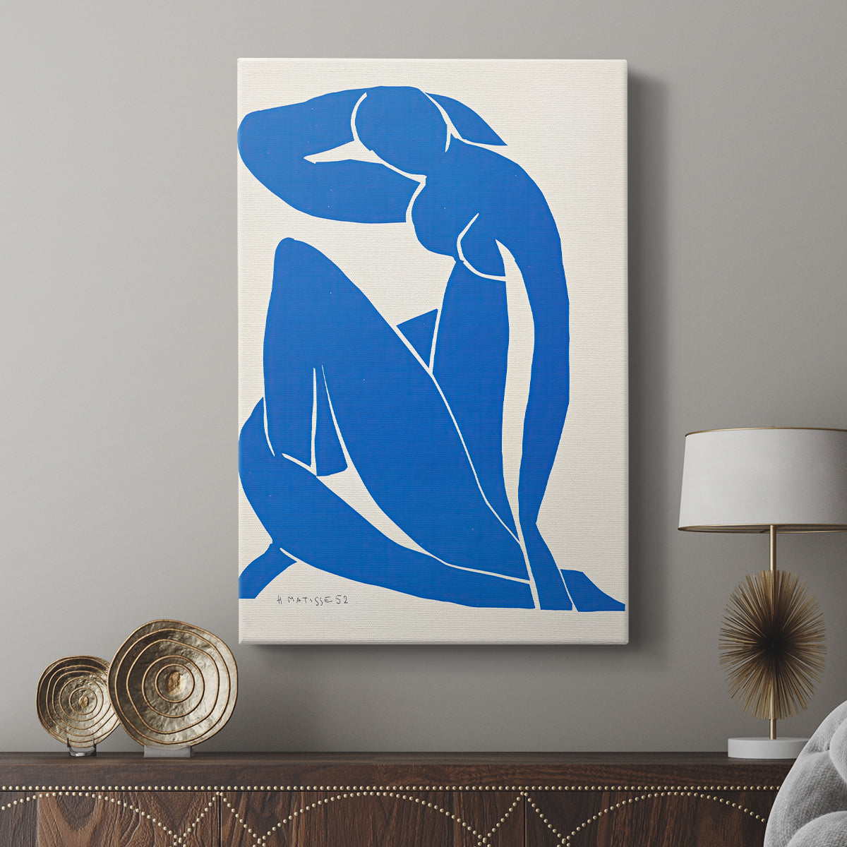 Canvas art print featuring a modern figure built from flat geometric forms displayed in a modern interior space.