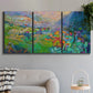 Three-panel canvas wall art featuring embracing landscape with warm tones, displayed in a modern living room above a sofa.