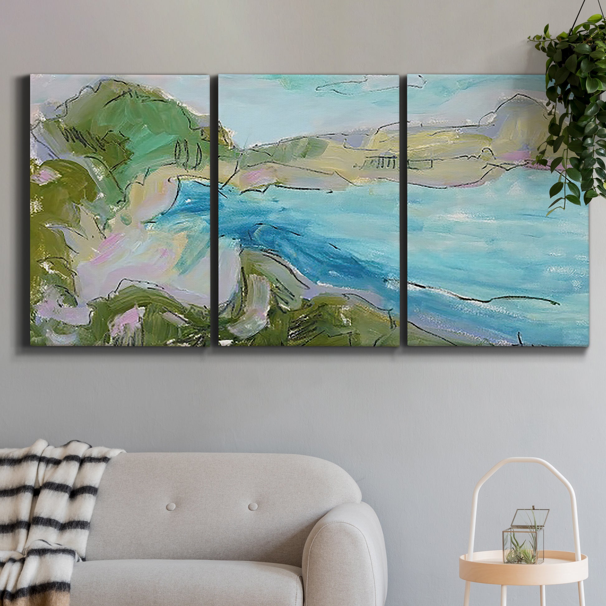 Three-panel canvas wall art featuring open landscape with landing strip, displayed in a modern living room above a sofa.