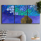 Three-panel canvas wall art featuring blue poppy floral abstraction, displayed in a modern living room above a sofa.