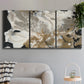 Three-panel canvas wall art featuring pale abstract mask like forms, displayed in a modern living room above a sofa.