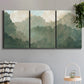 Three-panel canvas wall art featuring autumn storm over rolling landscape, displayed in a modern living room above a sofa.