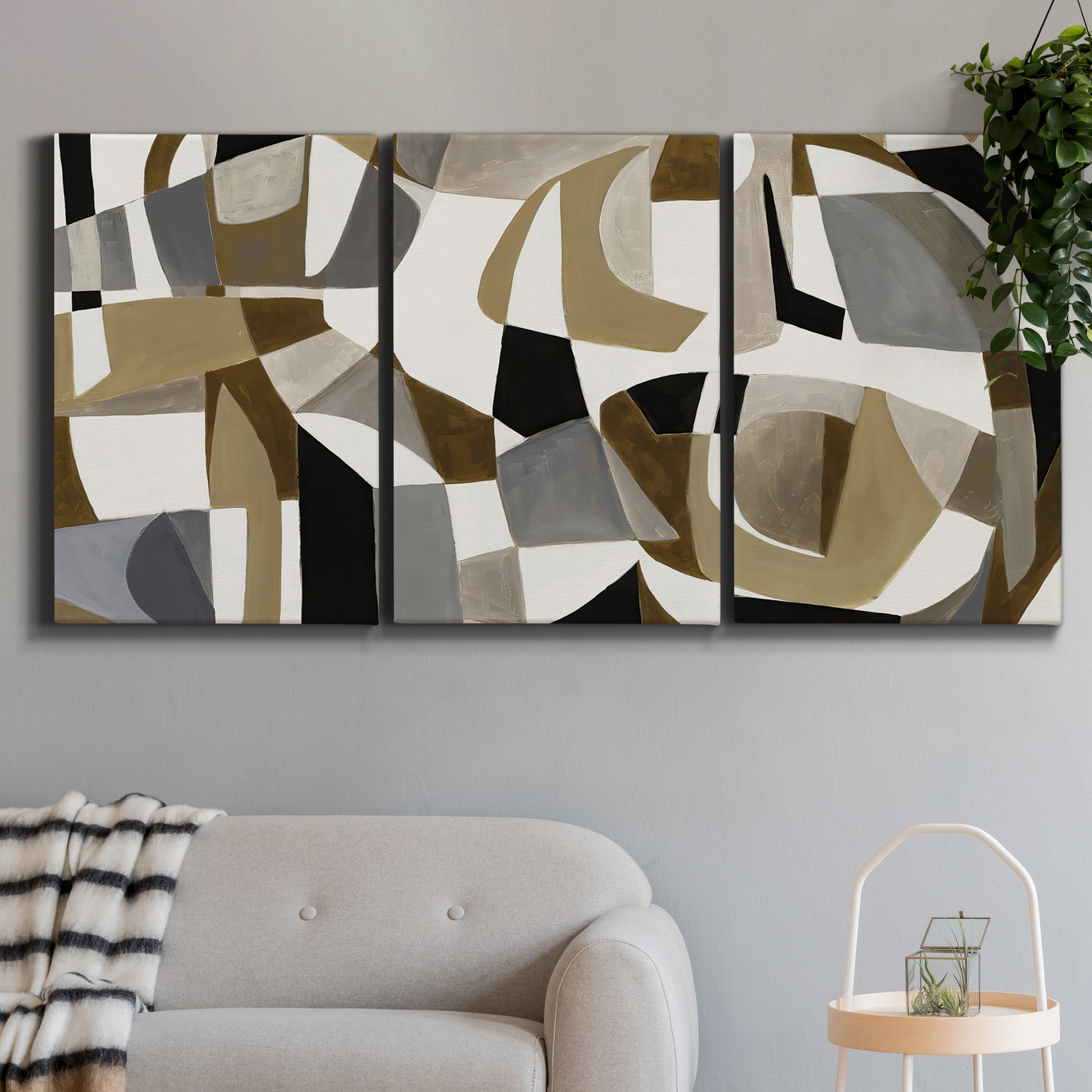 Three-panel canvas wall art featuring overlapping mid century geometric shapes, displayed in a modern living room above a sofa.