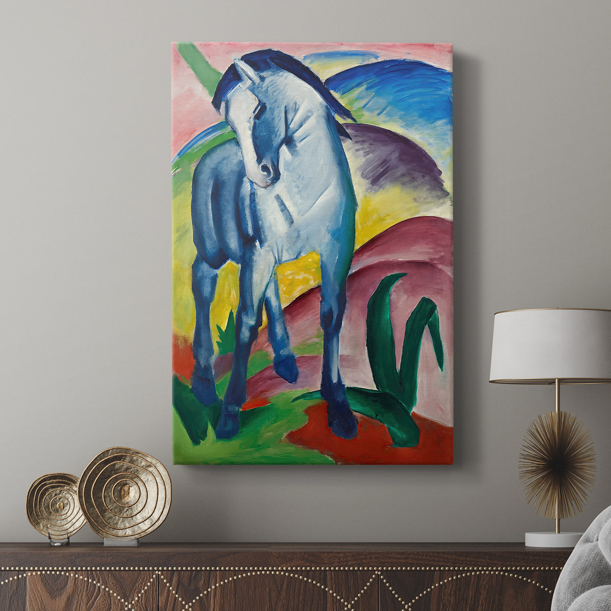 Canvas art print featuring a vibrant composition with a horse and flowing shapes displayed in a modern interior space.