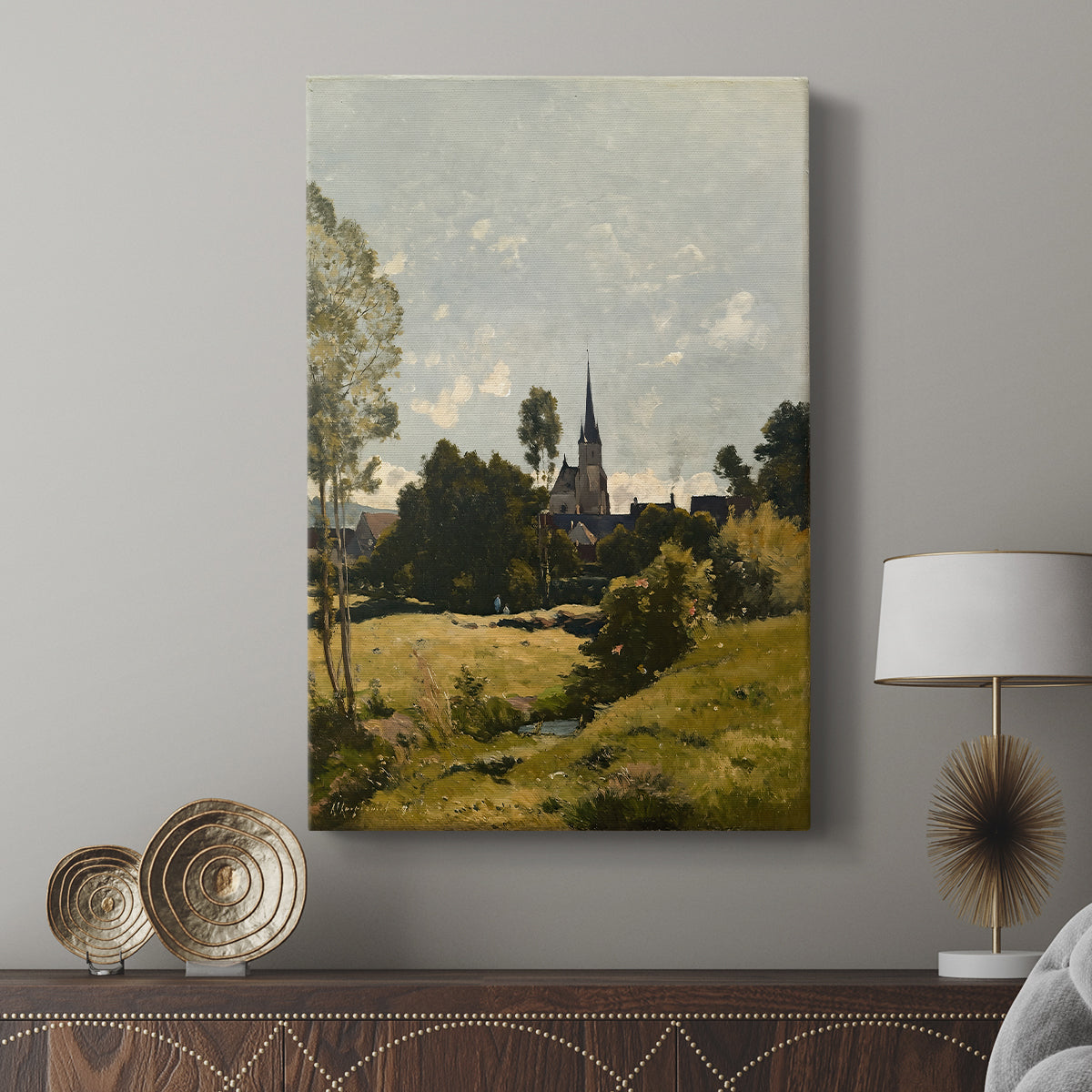 Canvas art print featuring a quiet countryside view with architecture and greenery displayed in a modern interior space.