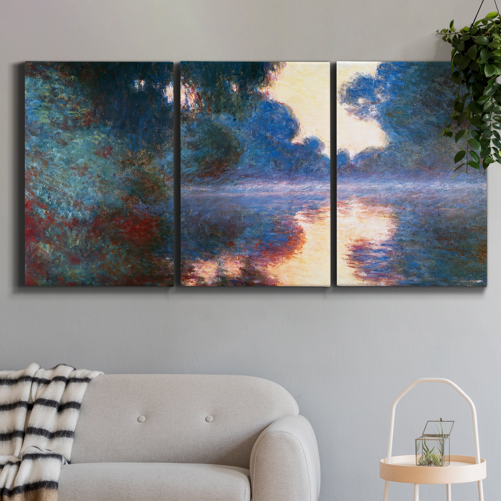 Three-panel canvas wall art featuring misty river surface at dawn, displayed in a modern living room above a sofa.