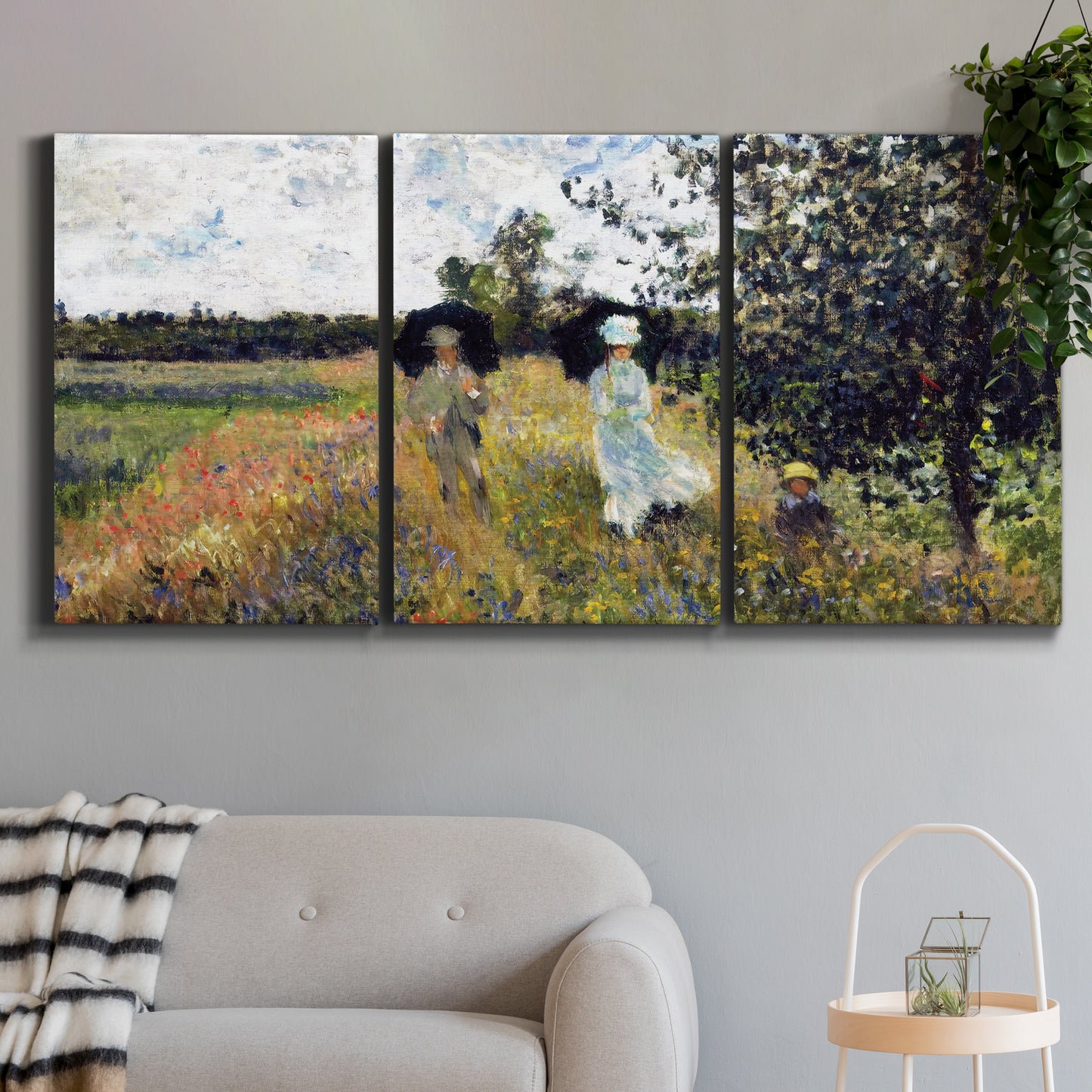 Three-panel canvas wall art featuring figures walking along riverbank, displayed in a modern living room above a sofa.