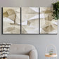 Three-panel canvas wall art featuring soft abstract meditative color balance, displayed in a modern living room above a sofa.