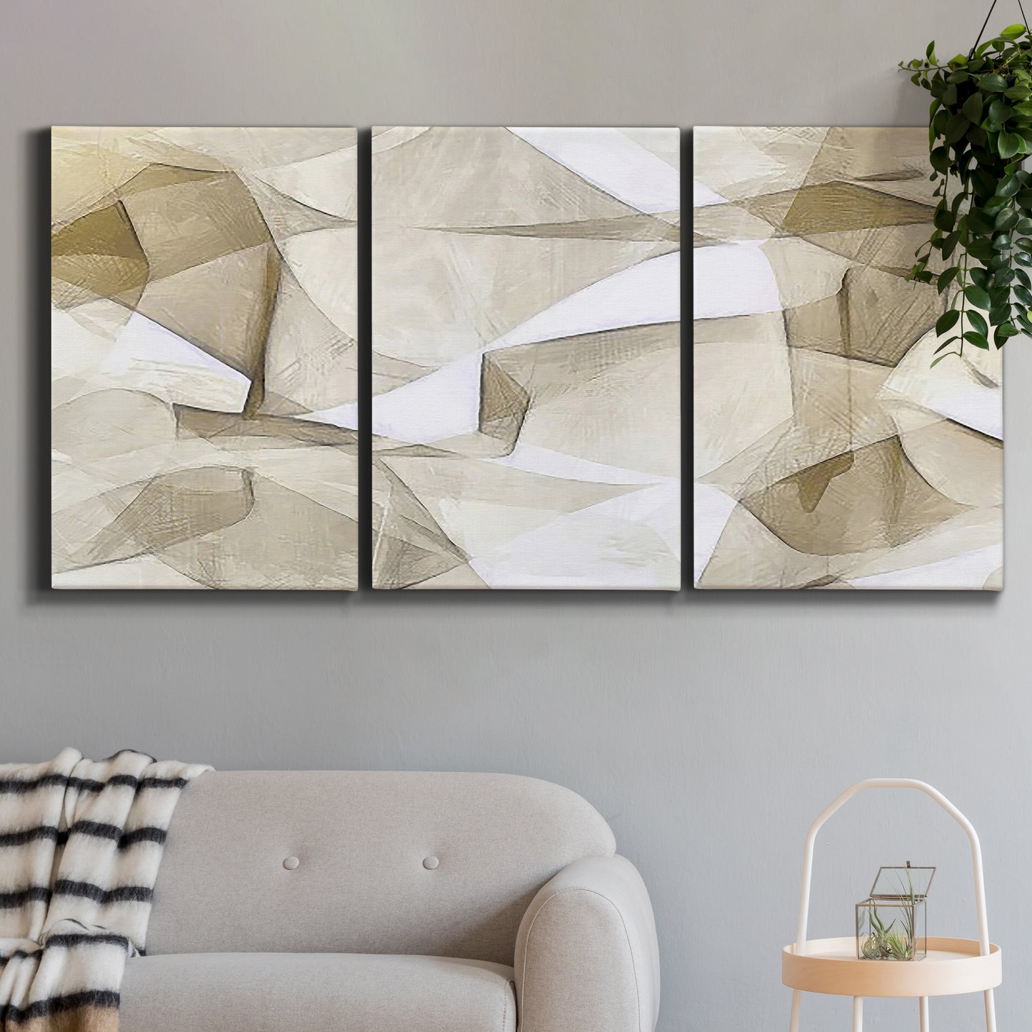 Three-panel canvas wall art featuring soft abstract meditative color balance, displayed in a modern living room above a sofa.