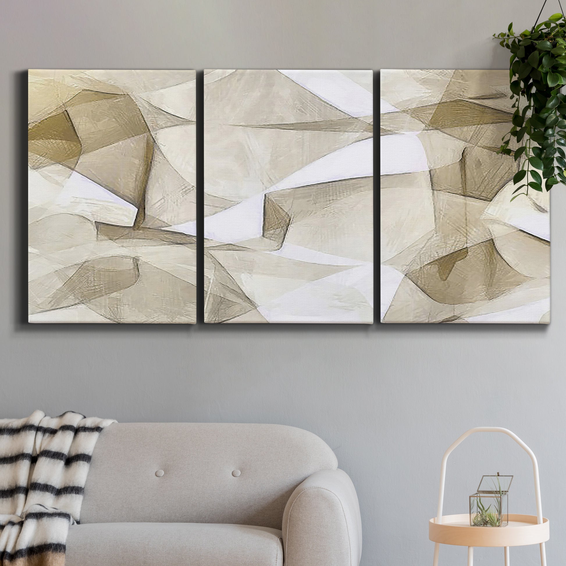 Three-panel canvas wall art featuring soft abstract meditative color balance, displayed in a modern living room above a sofa.
