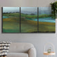 Three-panel canvas wall art featuring quiet contemplative landscape scene, displayed in a modern living room above a sofa.