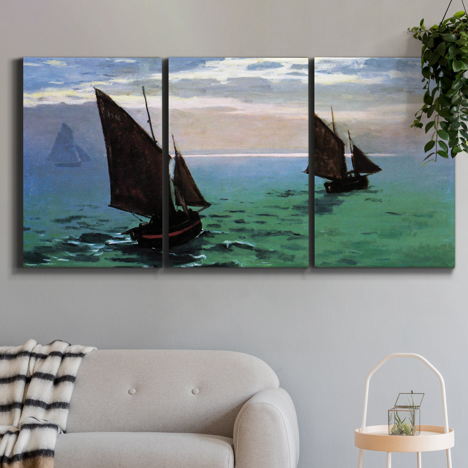 Three-panel canvas wall art featuring fishing boats moving through open sea, displayed in a modern living room above a sofa.