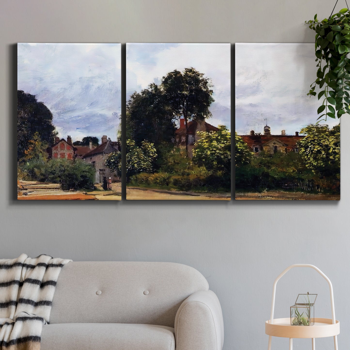 Three-panel canvas wall art featuring garden corner with flowering trees, displayed in a modern living room above a sofa.