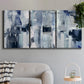 Three-panel canvas wall art featuring soft abstract mountain color fields, displayed in a modern living room above a sofa.