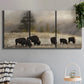 Three-panel canvas wall art featuring cattle grazing along ridge line, displayed in a modern living room above a sofa.