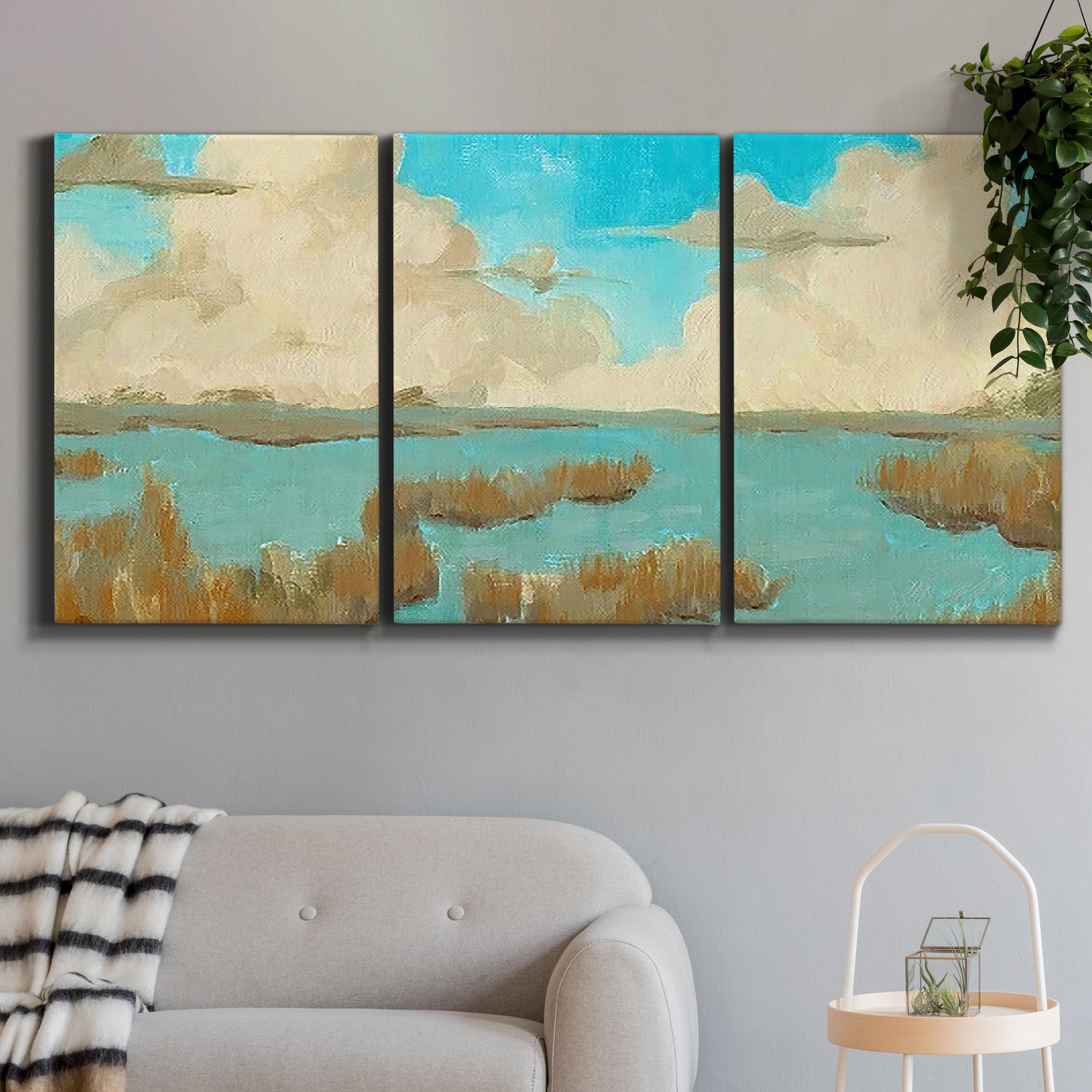 Three-panel canvas wall art featuring abstract pond scene with reflections, displayed in a modern living room above a sofa.