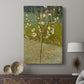 Canvas art print featuring a stylized tree with strong outlines and textured strokes displayed in a modern interior space.